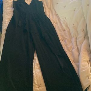 Bebe size medium jumpsuit with ruffle down the front draping worn once